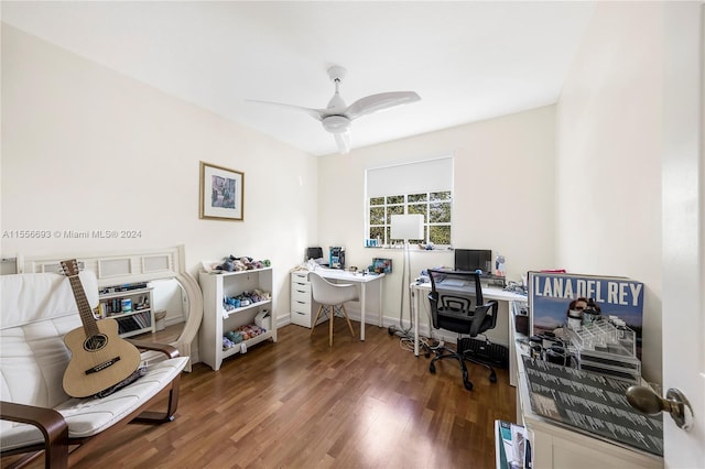 home office with ceiling fan and dark hardwood / wood-style floors