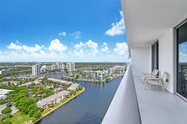 balcony featuring a water view