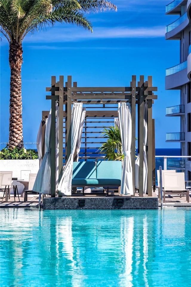 view of swimming pool with a pergola