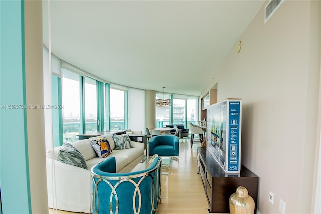 living room featuring light hardwood / wood-style flooring and expansive windows