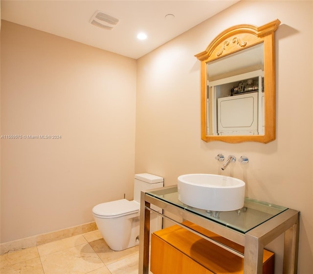 bathroom featuring tile patterned floors, toilet, and sink