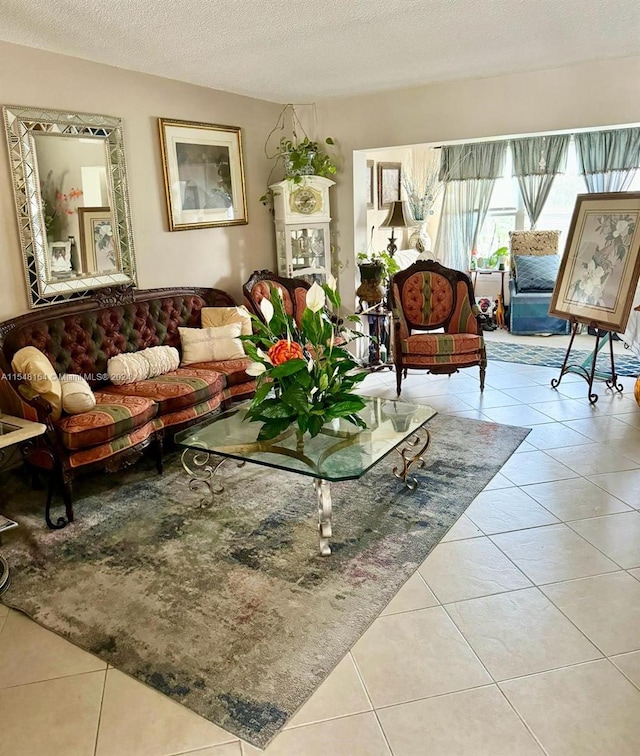 tiled living room featuring a textured ceiling