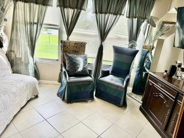 sitting room featuring light tile flooring