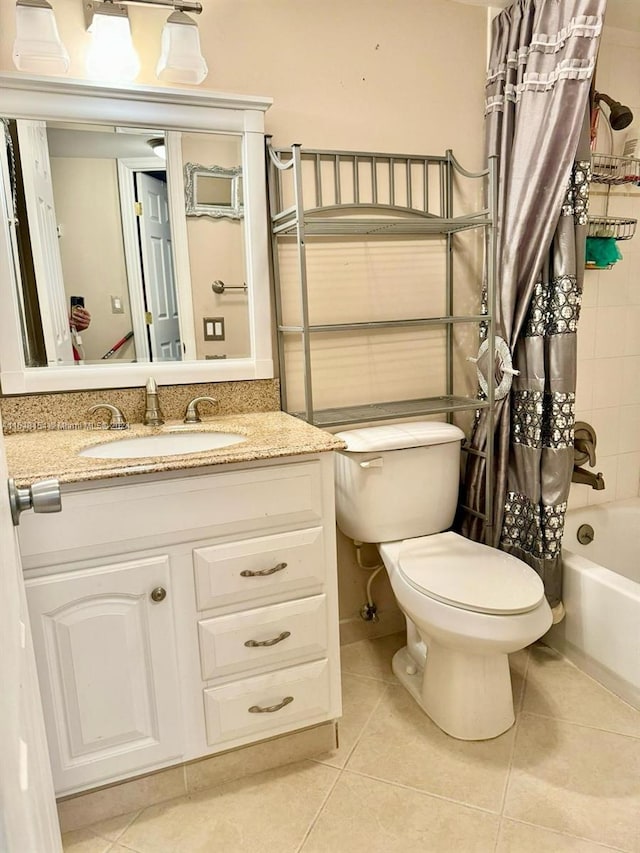 full bathroom with shower / bath combination with curtain, oversized vanity, toilet, and tile flooring