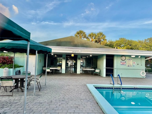 back of house featuring a patio and a community pool