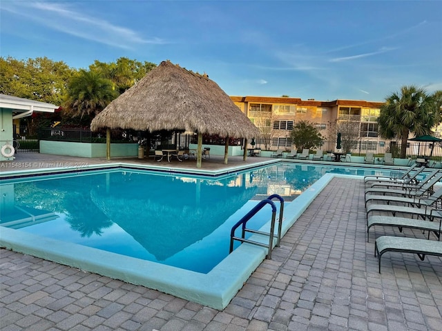 view of swimming pool with a gazebo and a patio area