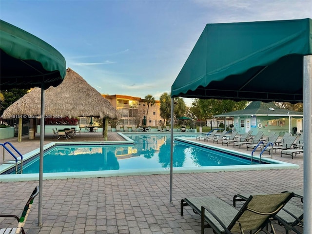 view of swimming pool featuring a gazebo and a patio