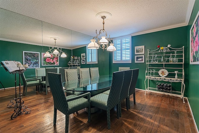 dining room with an inviting chandelier, ornamental molding, dark hardwood / wood-style floors, and a textured ceiling