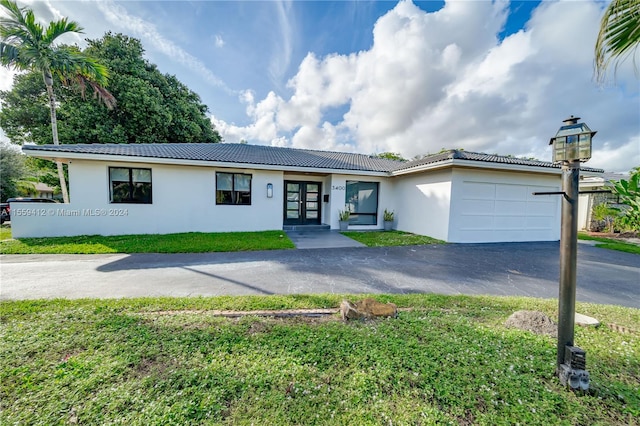 ranch-style home with a garage