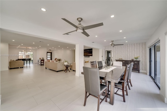 tiled dining area featuring plenty of natural light and ceiling fan