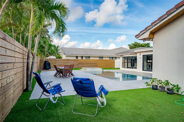 view of yard featuring a patio and a fenced in pool