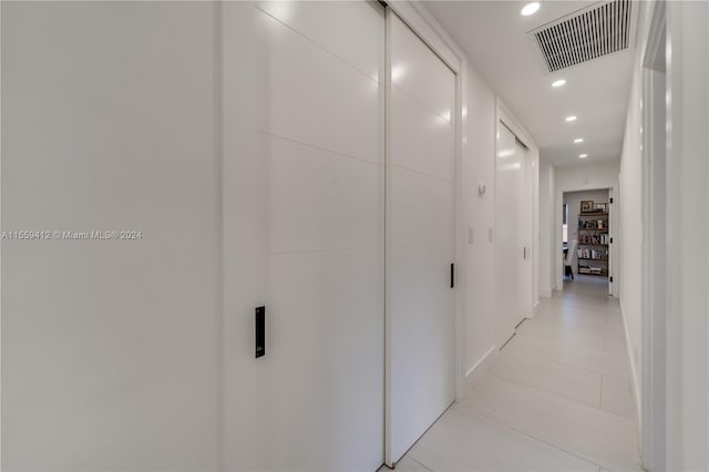 hallway with light tile floors