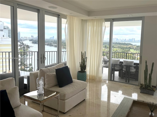 interior space with light tile floors, french doors, and a water view