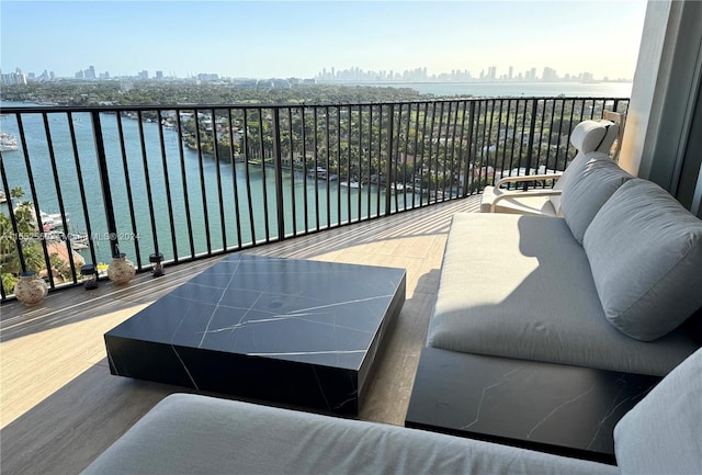 balcony featuring a water view