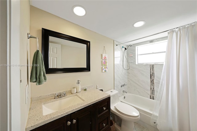 full bathroom featuring shower / bath combo, toilet, and vanity