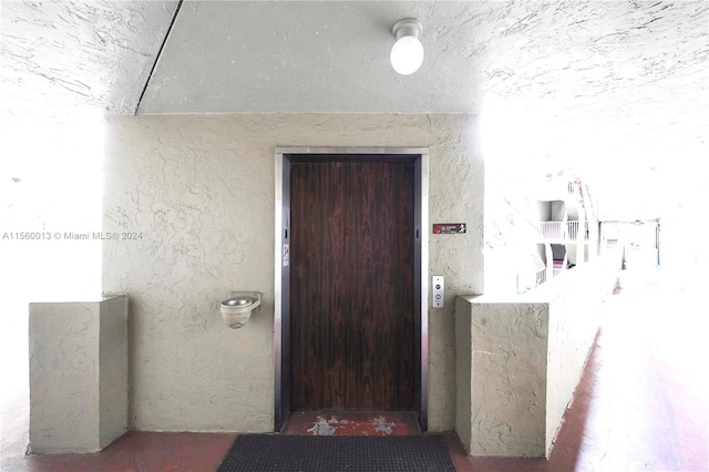 view of exterior entry featuring elevator