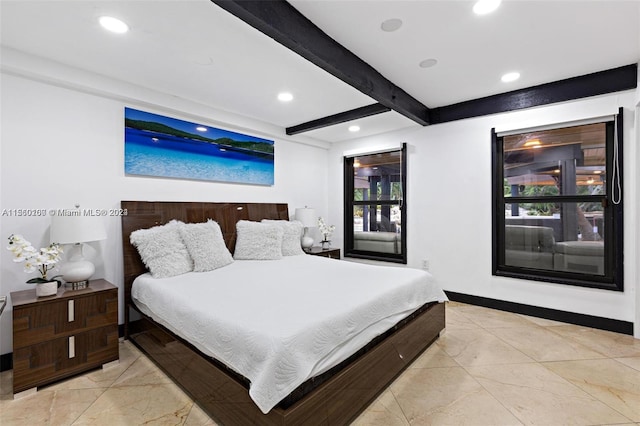 bedroom with multiple windows and beamed ceiling