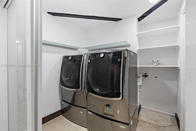 laundry area featuring independent washer and dryer