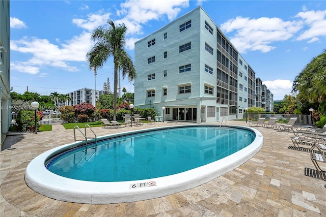 view of swimming pool with a patio