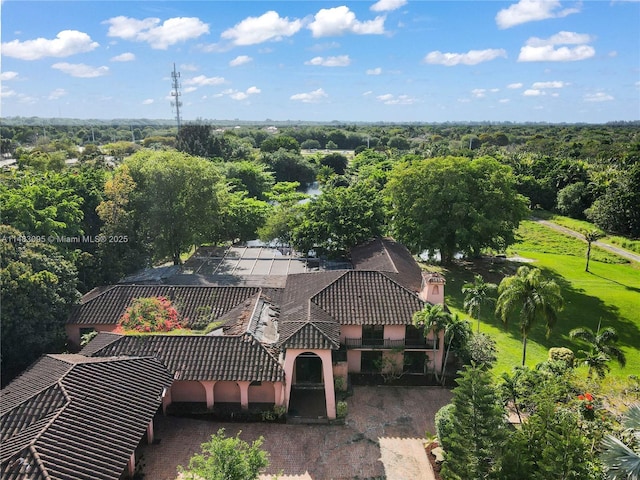 drone / aerial view featuring a view of trees