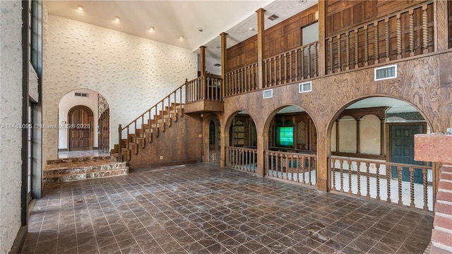 interior space featuring stairs and a high ceiling