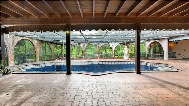 view of pool with a patio area and an empty pool