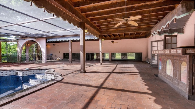 view of patio with ceiling fan, a lanai, and an outdoor pool