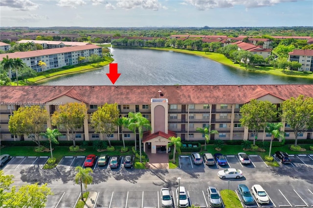 birds eye view of property featuring a water view