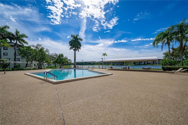 view of swimming pool with a patio