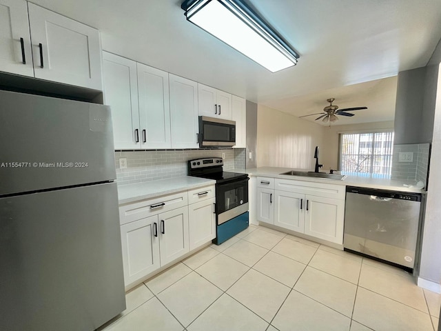 kitchen featuring sink, backsplash, ceiling fan, and stainless steel appliances