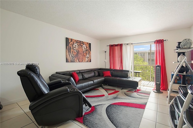 tiled living room featuring a textured ceiling