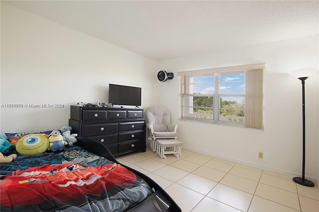 bedroom featuring light tile flooring