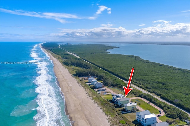 drone / aerial view with a view of the beach and a water view