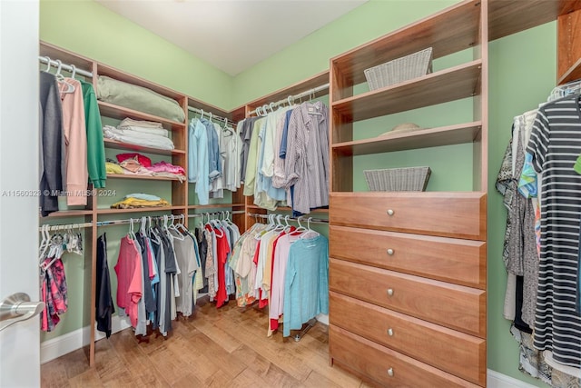 spacious closet featuring light hardwood / wood-style floors