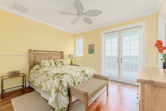 bedroom with crown molding, access to exterior, ceiling fan, and hardwood / wood-style floors