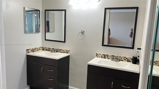 bathroom featuring tasteful backsplash and double vanity