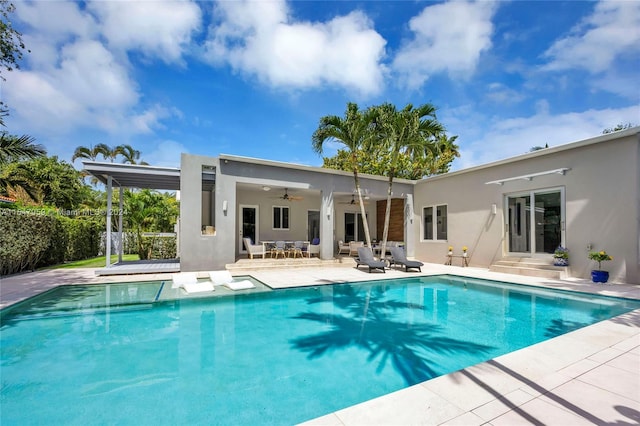 view of pool featuring a patio area and ceiling fan