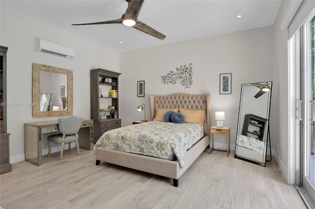 bedroom featuring ceiling fan, light wood-type flooring, and a wall unit AC