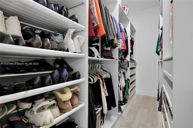 walk in closet featuring light wood-type flooring