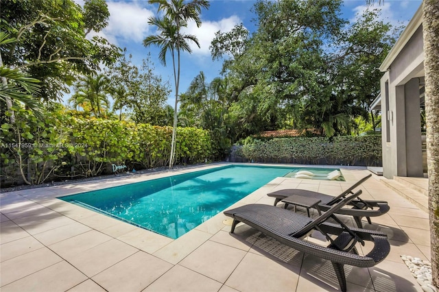 view of swimming pool featuring a patio