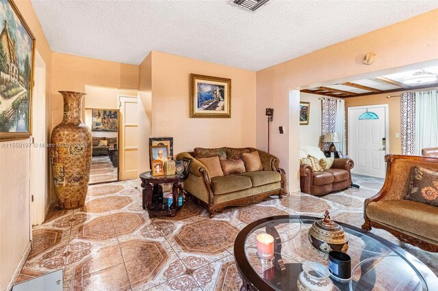 living room featuring a textured ceiling