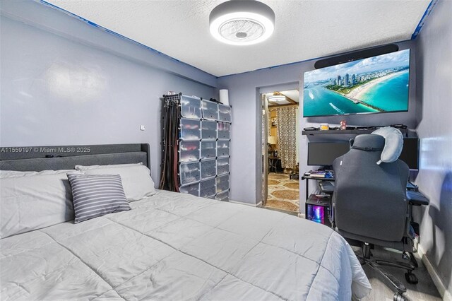 bedroom featuring a textured ceiling