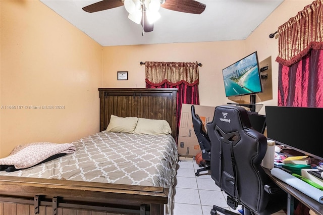 tiled bedroom with ceiling fan