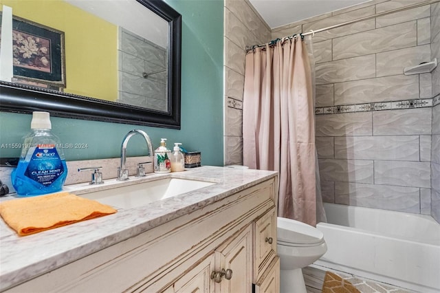 full bathroom featuring shower / bath combo, toilet, and vanity