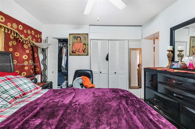 bedroom featuring multiple closets and ceiling fan