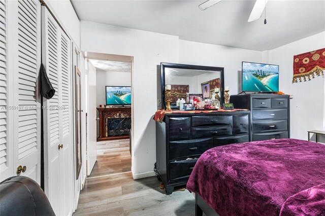 bedroom featuring ceiling fan and light hardwood / wood-style flooring