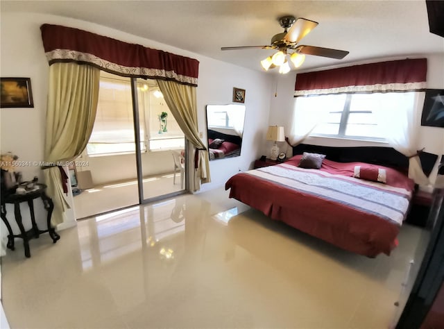 tiled bedroom featuring ceiling fan and multiple windows