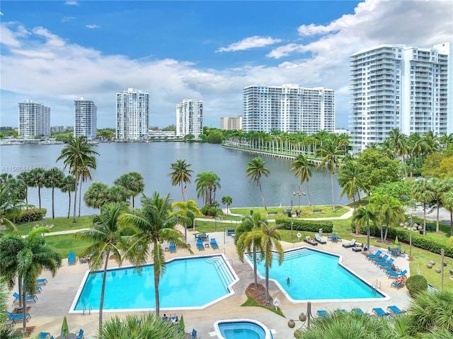 view of pool with a water view