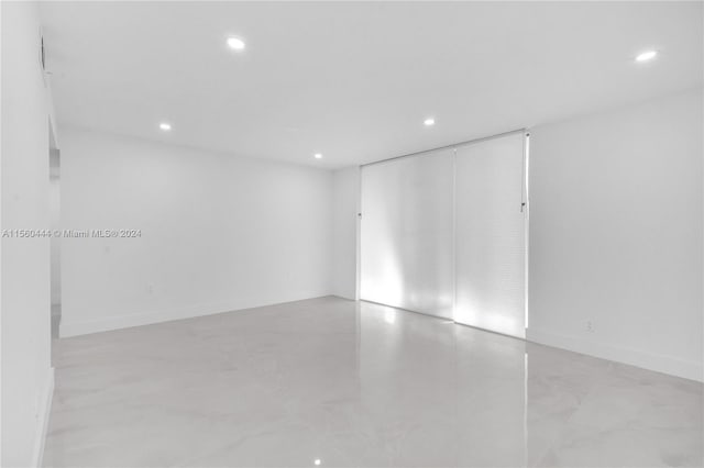 unfurnished room featuring light tile floors