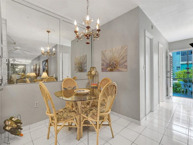 dining room featuring light tile patterned flooring, baseboards, and ceiling fan with notable chandelier